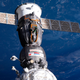 A photo of a Soyuz capsule docked with the International Space Station.